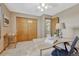 Well-lit home office area with a desk, chair, and view into another room at 36921 Ruger Ct, Elizabeth, CO 80107