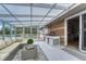 Sunroom with a cozy seating area, white wood flooring, and stylish decor at 36921 Ruger Ct, Elizabeth, CO 80107