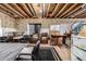 Unfinished basement featuring exposed ceiling beams, a lounge area, and potential for customization at 21271 E Smoky Hill Rd, Centennial, CO 80015