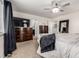 Spacious bedroom featuring a large bed, dresser, walk-in closet, and ample space for furniture and decor at 21271 E Smoky Hill Rd, Centennial, CO 80015