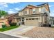 Beautiful home with a well-maintained lawn and attached two-car garage at 21271 E Smoky Hill Rd, Centennial, CO 80015