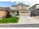 Charming two-story home featuring a well-manicured lawn and inviting front porch at 21271 E Smoky Hill Rd, Centennial, CO 80015