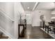 Welcoming hallway featuring elegant decor, natural light, and seamless flow to the adjacent dining area and staircase at 21271 E Smoky Hill Rd, Centennial, CO 80015