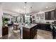 Open concept kitchen with stainless steel appliances, granite counters, and seamless flow to dining at 21271 E Smoky Hill Rd, Centennial, CO 80015