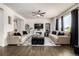 Spacious living room with a fireplace, large windows, and comfortable seating, offering an inviting atmosphere for relaxation at 21271 E Smoky Hill Rd, Centennial, CO 80015