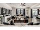 Inviting living room with a fireplace, large windows, stylish decor, and seamless access to the outdoor patio at 21271 E Smoky Hill Rd, Centennial, CO 80015