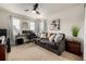 Inviting living room features a comfortable sofa, desk area, and contemporary décor, creating a relaxing and functional space at 21271 E Smoky Hill Rd, Centennial, CO 80015