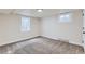 Bright and airy basement bedroom with neutral walls and carpeting at 6196 W 66Th Ave, Arvada, CO 80003