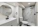 Basement bathroom with modern fixtures and marble-style tile at 6196 W 66Th Ave, Arvada, CO 80003