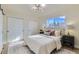 Bright bedroom with double door closets and en-suite bathroom at 6196 W 66Th Ave, Arvada, CO 80003