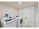 Basement laundry room with washer, dryer, and extra storage at 6196 W 66Th Ave, Arvada, CO 80003