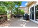 Spacious back deck with dining set and grill, perfect for outdoor entertaining and relaxation at 12000 Pine Top St, Parker, CO 80138