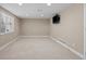 Open basement featuring recessed lighting, neutral paint, and a wall-mounted television at 12000 Pine Top St, Parker, CO 80138