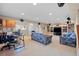 Entertainment basement featuring built-in shelving, unique fireplace and comfortable seating at 12000 Pine Top St, Parker, CO 80138