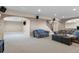 Finished basement featuring an open layout, neutral carpet, and comfortable seating area at 12000 Pine Top St, Parker, CO 80138