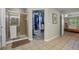 Bathroom featuring glass-enclosed shower and walk-in closet at 12000 Pine Top St, Parker, CO 80138