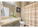 Cozy powder room with shower/tub combo and neutral tones at 12000 Pine Top St, Parker, CO 80138