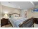 Comfortable bedroom with neutral colors, featuring a view of a staircase through the door at 12000 Pine Top St, Parker, CO 80138
