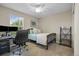 Bright bedroom featuring a desk, chair, neutral paint, and a ceiling fan at 12000 Pine Top St, Parker, CO 80138
