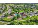 Aerial view of community pool and clubhouse, offering a variety of recreational amenities and green spaces at 12000 Pine Top St, Parker, CO 80138