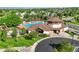 Community pool and clubhouse featuring a spacious pool area, comfortable lounge chairs, and shaded pergolas at 12000 Pine Top St, Parker, CO 80138
