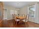 Formal dining room showcasing wood floors and a large table with seating at 12000 Pine Top St, Parker, CO 80138