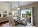 Dining room featuring hardwood floors, a chandelier, and a large table with seating for six at 12000 Pine Top St, Parker, CO 80138