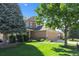Charming two-story home features a well-manicured lawn, mature trees and a three car garage at 12000 Pine Top St, Parker, CO 80138