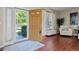 Welcoming foyer with hardwood floors, coat closet, and view into the living room at 12000 Pine Top St, Parker, CO 80138