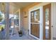 Inviting front porch with a rocking chair and a view of the house number above a brick accent wall at 12000 Pine Top St, Parker, CO 80138