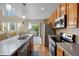 Kitchen with stainless steel appliances, a center island, and a view of the backyard at 12000 Pine Top St, Parker, CO 80138