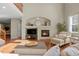 Inviting living room featuring a fireplace, hardwood floors, and comfortable seating at 12000 Pine Top St, Parker, CO 80138