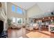 Bright and airy living room with vaulted ceiling, hardwood floors, and open floor plan at 12000 Pine Top St, Parker, CO 80138