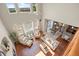 Open-concept living area with vaulted ceilings, hardwood floors, and abundant natural light at 12000 Pine Top St, Parker, CO 80138