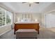 Serene main bedroom offers natural light and a large window overlooking the backyard at 12000 Pine Top St, Parker, CO 80138