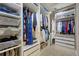 Custom walk-in closet featuring ample shelving, drawers, and hanging space at 12000 Pine Top St, Parker, CO 80138