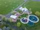 High aerial showcasing community park with playground, picnic pavilion, green sports fields, and walking trails at 10723 W 54Th Pl, Arvada, CO 80002