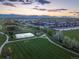 Scenic high aerial shot showcasing new apartments, sports fields, and walking trails at 10723 W 54Th Pl, Arvada, CO 80002