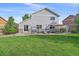 Expansive backyard featuring a well-maintained lawn and a patio area perfect for outdoor living and entertaining at 10723 W 54Th Pl, Arvada, CO 80002