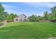 A sprawling backyard featuring a well-maintained lawn and a charming patio area for relaxation and entertainment at 10723 W 54Th Pl, Arvada, CO 80002