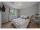 Comfortable bedroom with a cozy bed, soft carpet, and a bright window offering a peaceful and relaxing atmosphere at 10723 W 54Th Pl, Arvada, CO 80002