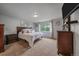 Cozy bedroom with carpet, large window, neutral colors, and ample natural light at 10723 W 54Th Pl, Arvada, CO 80002