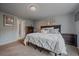 Bedroom featuring a comfortable bed, carpet floors, and neutral wall colors at 10723 W 54Th Pl, Arvada, CO 80002