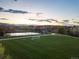 Beautiful community park with a soccer field, walking path, and a tennis court for outdoor recreation at 10723 W 54Th Pl, Arvada, CO 80002