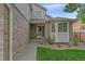 Charming entrance to the home with a well-maintained lawn and garden at 10723 W 54Th Pl, Arvada, CO 80002