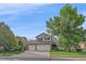 Charming two-story home with a three-car garage and well-manicured lawn at 10723 W 54Th Pl, Arvada, CO 80002