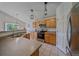 Spacious eat-in kitchen with stainless appliances, tile floors, and plentiful cabinet space at 10723 W 54Th Pl, Arvada, CO 80002
