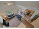Open-concept living room with vaulted ceilings flowing into a modern kitchen and dining area, perfect for entertaining at 10723 W 54Th Pl, Arvada, CO 80002