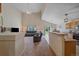 Open-concept living room with a view of the dining area and kitchen at 10723 W 54Th Pl, Arvada, CO 80002