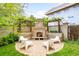 Backyard featuring a custom brick fireplace with seating and a paved patio perfect for outdoor entertaining at 677 N Gilpin St, Denver, CO 80218